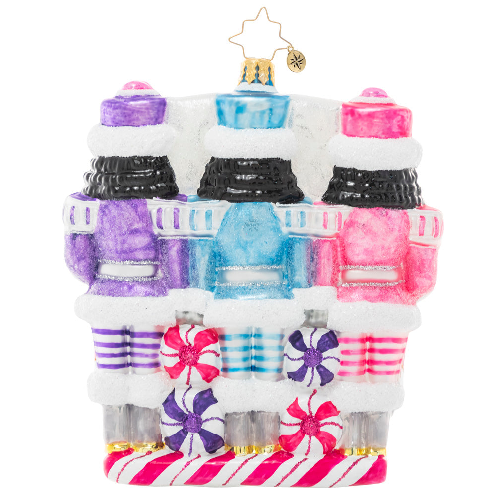 Back - Ornament Description - The Sweetest Trio: A trio of nutcrackers smile dutifully from their posts, dressed in uniforms of wintry pastels. Someone's got to guard the North Pole candy stash, and three heads are better than one!