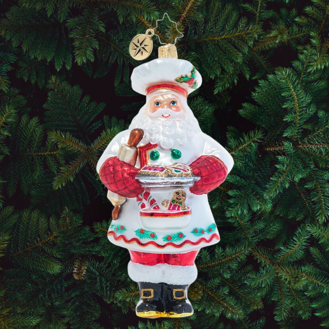 Ornament Description - Cheerful Christmas Confectioner: A man of many talents, it should come as no surprise that Santa is a masterful Christmas cookie baker. He'll never share his secret ingredient, but we have a feeling it has to do with a little Christmas magic!