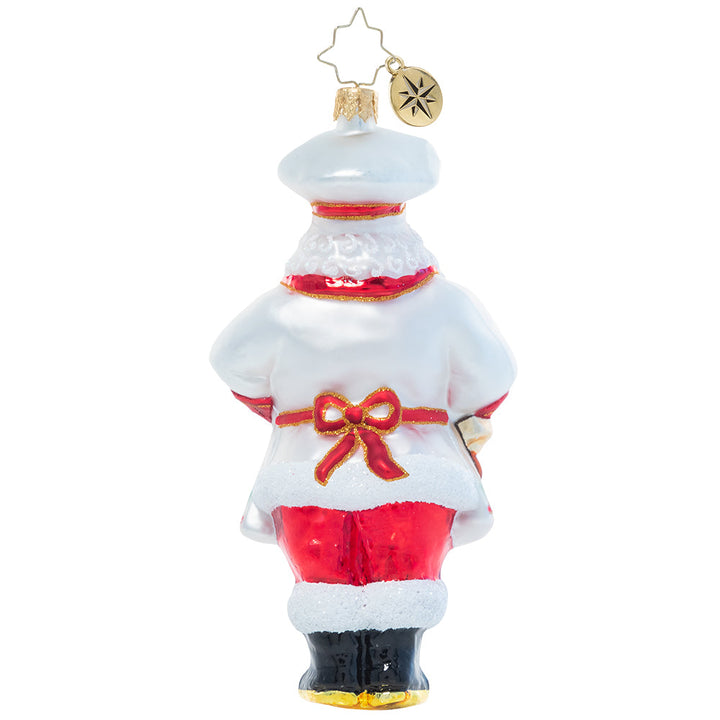 Back - Ornament Description - Cheerful Christmas Confectioner: A man of many talents, it should come as no surprise that Santa is a masterful Christmas cookie baker. He'll never share his secret ingredient, but we have a feeling it has to do with a little Christmas magic!