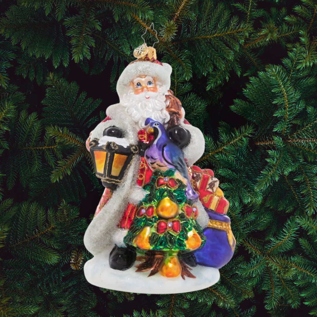 Ornament Description - Santa's Pear Tree: The premier piece in our Ornament of the Month collection, this elegant ornament features a traditional Santa Claus presiding over a golden pear tree topped with a colorful partridge bird.