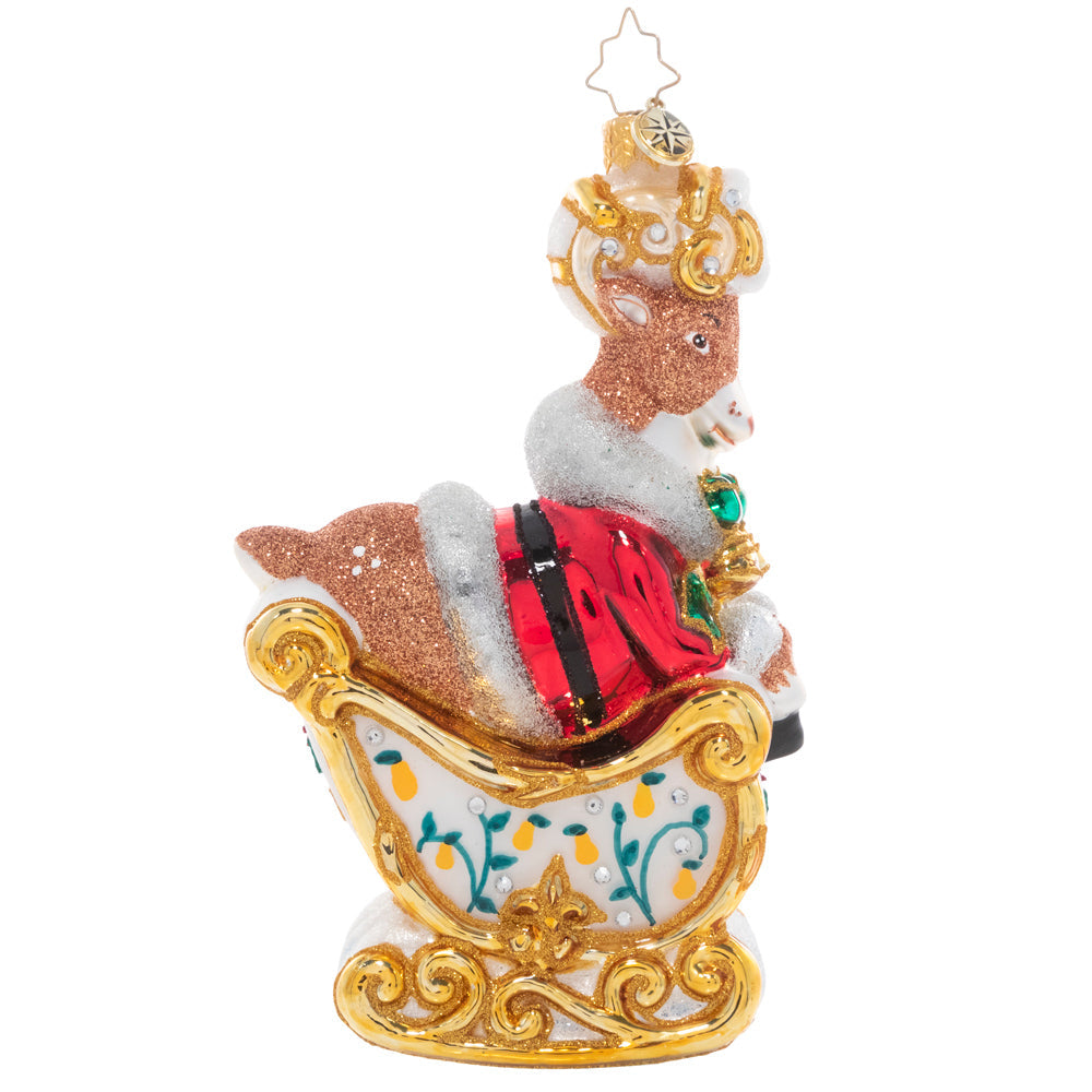 Back - Ornament Description - Gleaming Golden Rings: On the fifth day of Christmas, my true love gave to me…a cheeky reindeer driving Santa's sleigh! The gilded sleigh, adorned with floral accents and a crest of five golden rings, flies through the air with Dasher at the helm. This and eleven additional fun pieces are available as part of our Ornament of the Month collection!