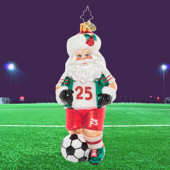 Ornament Description - Kick it Like Kringle: Go, Santa, Go! In the off season, St. Nick stays fit by playing soccer with the elves. Cheer him on with this festive, sporty ornament.