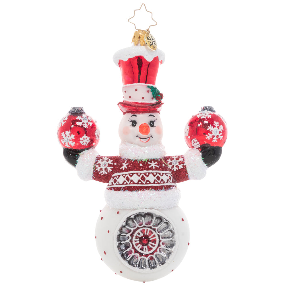 Front - Ornament Description - Cheery Snowman Juggler: This acrobatic snowman is ready to demonstrate his tricks and spread good cheer by juggling two festive Christmas ornaments.