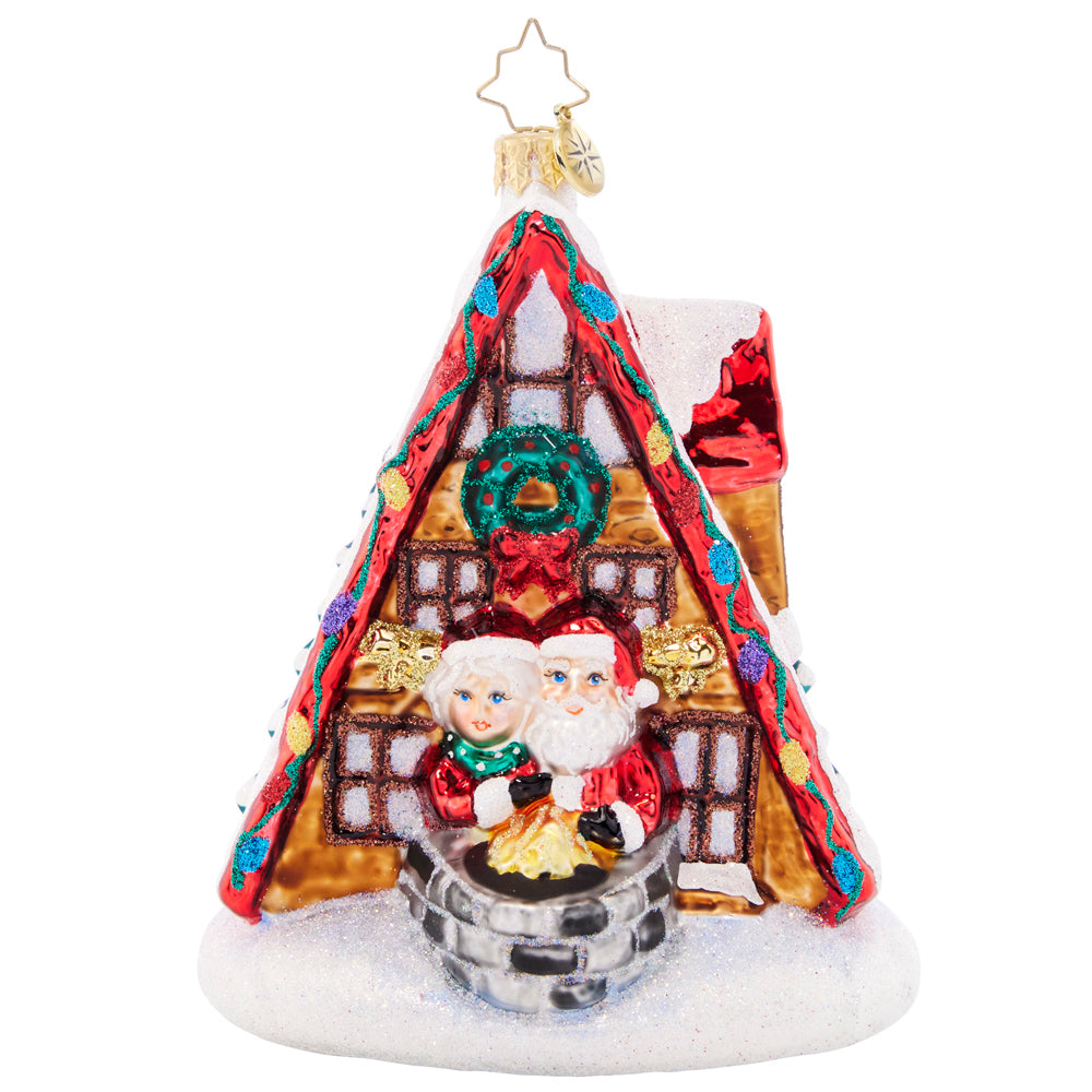 Ornament Description - Alpine A-Frame: Mr. and Mrs. Claus are enjoying a much-needed ski vacation at their cozy alpine lodge. What a sweet winter getaway for the jolly couple!