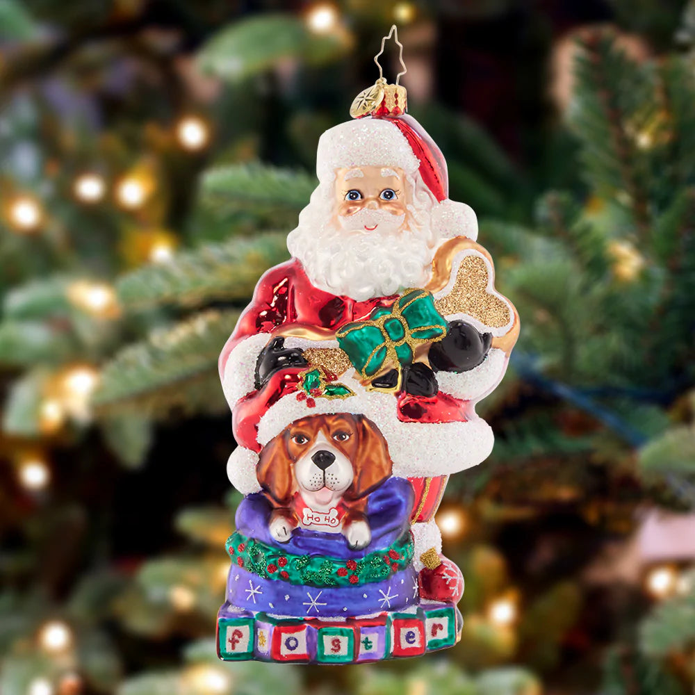 Ornament Description - Santa's Foster Friend: Santa is a friend to all, especially his sweet foster dog Fido. Celebrate the beloved furry friends in your family this Christmasd with a cherished hand-painted ornament.