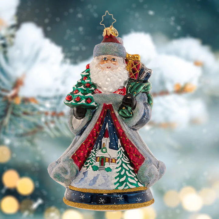 Ornament Description - Santa's Snowy Scene: The 2023 Christopher Radko Designer’s ornament, this special piece encapsulates the magic of Christmas with a beautiful wintertime landscape, which is hand-painted with care onto Santa’s magnificent robe. Designed by veteran artist, Joseph Walden, Santa’s Snowy Scene is a cherished collector’s piece that celebrates the enchanting ambiance of the holiday season.