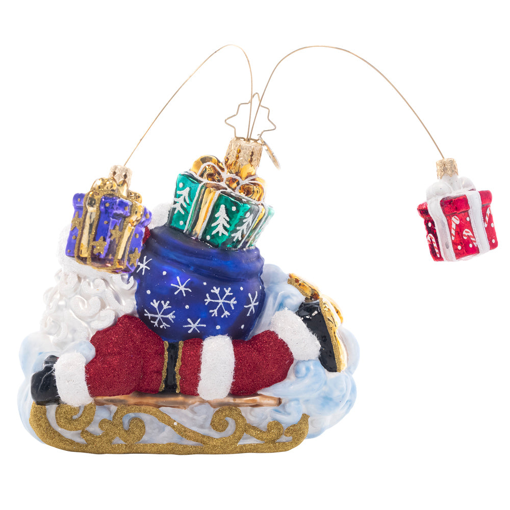 Back - Slipping and sliding through the snow, Santa is having fun while making a sled-powered Christmas gift delivery!