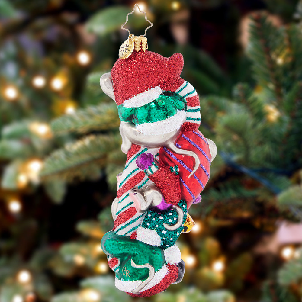 Back - Ornament Description - Making Mouse-chief: These three mischievous mice are feeling particularly merry, now that they've got their paws on a giant candy cane! Nestle this adorable piece among the boughs of your tree, and enjoy a glimpse of Christmas glee!