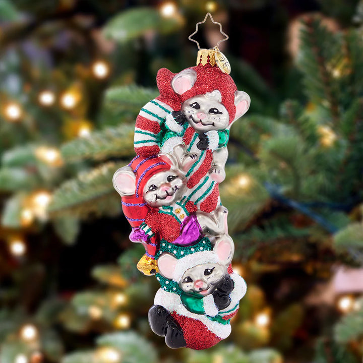 Ornament Description - Making Mouse-chief: These three mischievous mice are feeling particularly merry, now that they've got their paws on a giant candy cane! Nestle this adorable piece among the boughs of your tree, and enjoy a glimpse of Christmas glee!