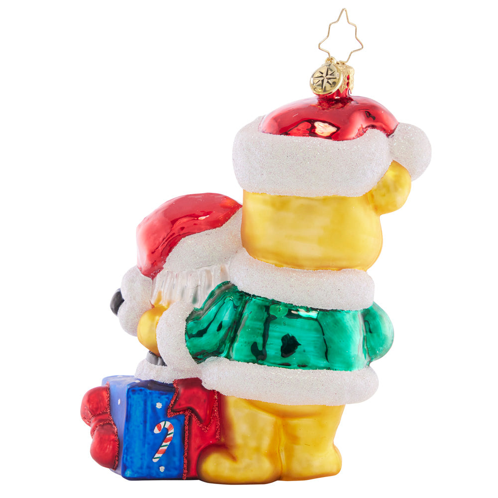 Back - Ornament Description - Present For Ted E. Bear: Surprise! This sweet teddy bear presents the perfect Christmas gift – a jolly Santa Claus filled with holiday cheer.