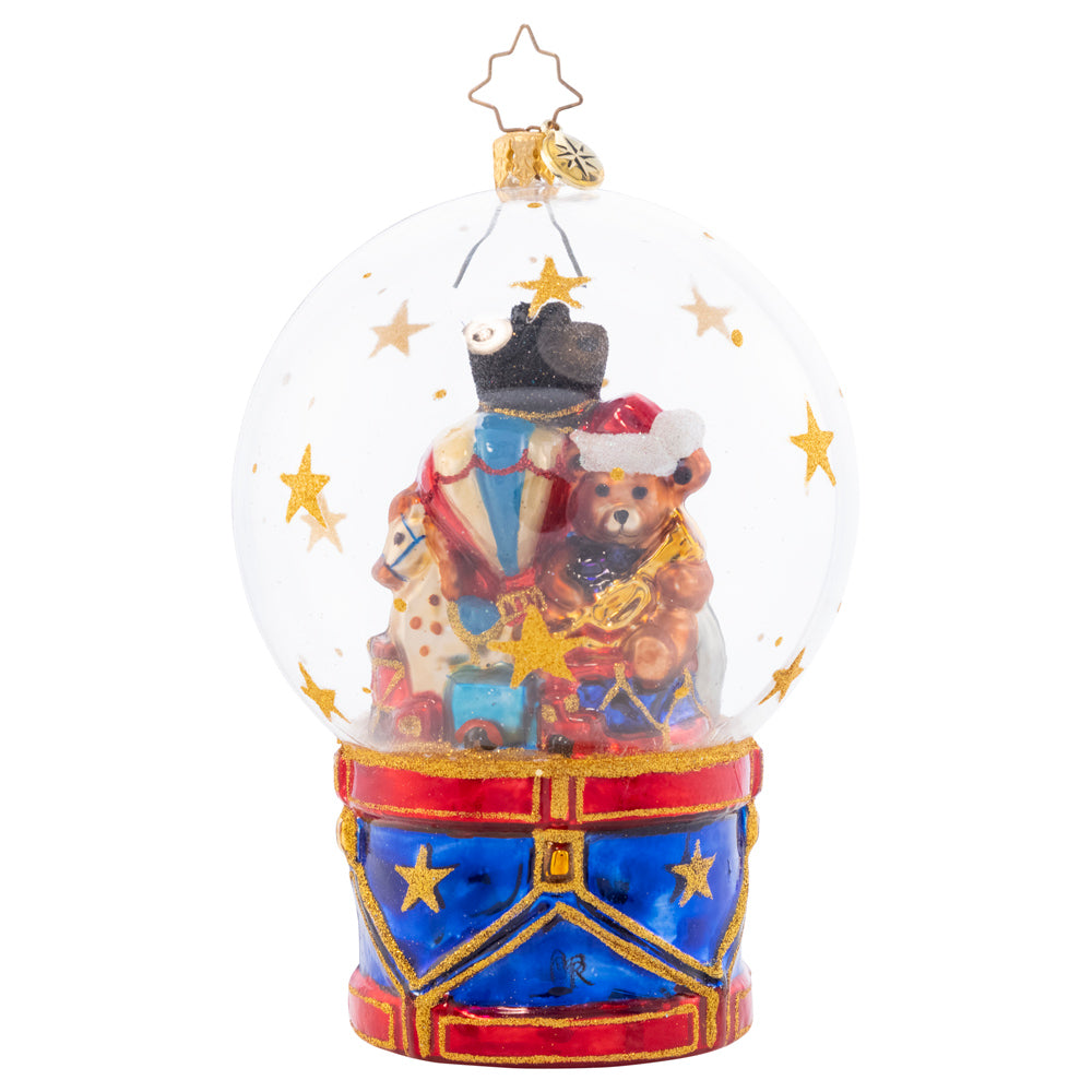 Back - Snowglobe Description - Toyland Treasures Snow Globe: A bountiful globe full of toys captures the treasure of life's many joys. Partake in the Christmastime wonder and cherish the gifts beneath the globe they are under.