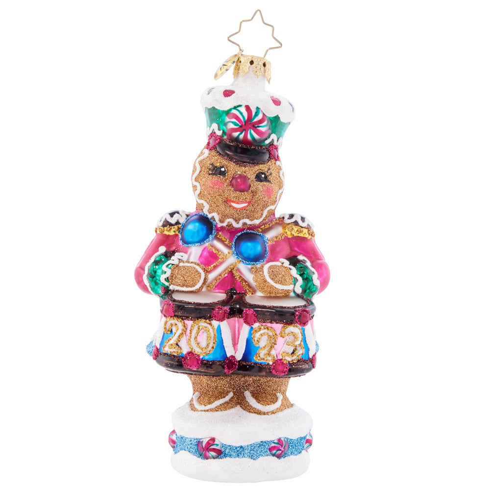 Front - Ornament Description - Drumroll Please: A gingerbread guard gallantly protects the candy castle, ensuring that it outlasts hungry hands of good little girls and boys before Christmas day.