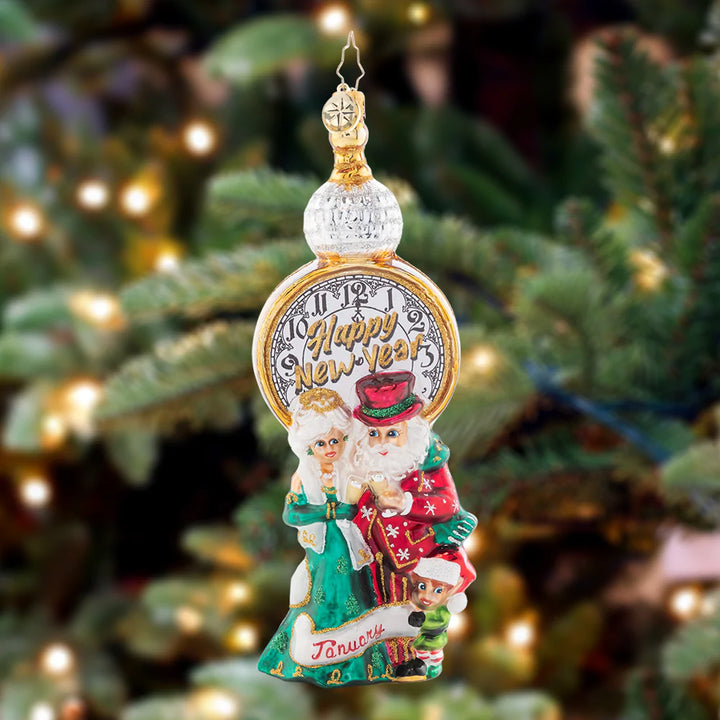 Ornament Description - In With the New: Santa and Mrs. Claus revel in cheer as they commemorate the start of a brand new year. The premier piece in our Ornament of the Month collection celebrates an exciting start to a wonderful year!