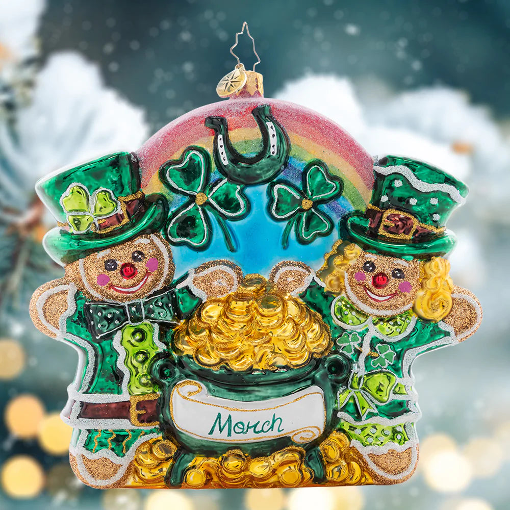 Ornament Description - Sweet Pot of Gold: These wee little gingerbread cookies cheers to the Luck O' the Irish! The third piece in our Ornament of the Month collection is perfect for St. Patty's Day.