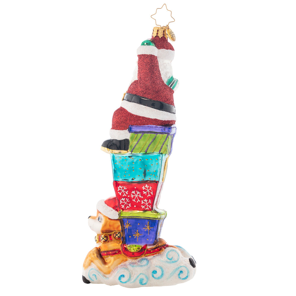Back - Ornament Description - Santa Parade: St. Nick sits atop a tall stack of brightly-wrapped gifts that spell out the New Year. He waves to his fans while his trusty reindeer works it for the Yuletide parade crowd. Personalize this treasure by adding the names of your family members to each gift. Note: Please allow approximately one month (on top of shipping time) for our elves to personalize your ornament.