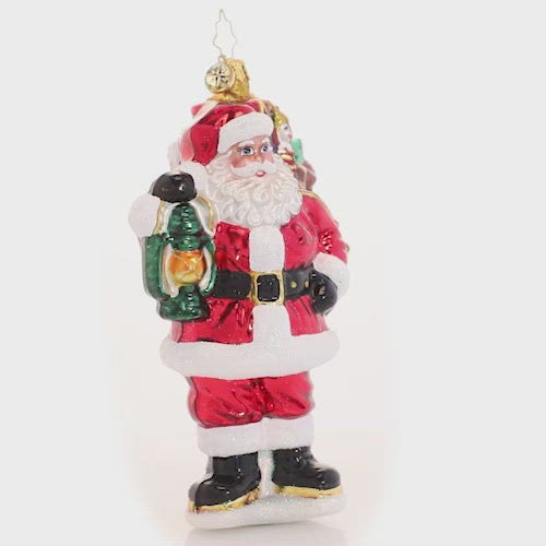 Video - Ornament Description - Our Gallant Guide: The city may be sleeping, but Santa's glowing lantern lights the way as he carries his magic sack of gifts through the darkness of Christmas Eve night. This video shows the ornament spinning slowly. 