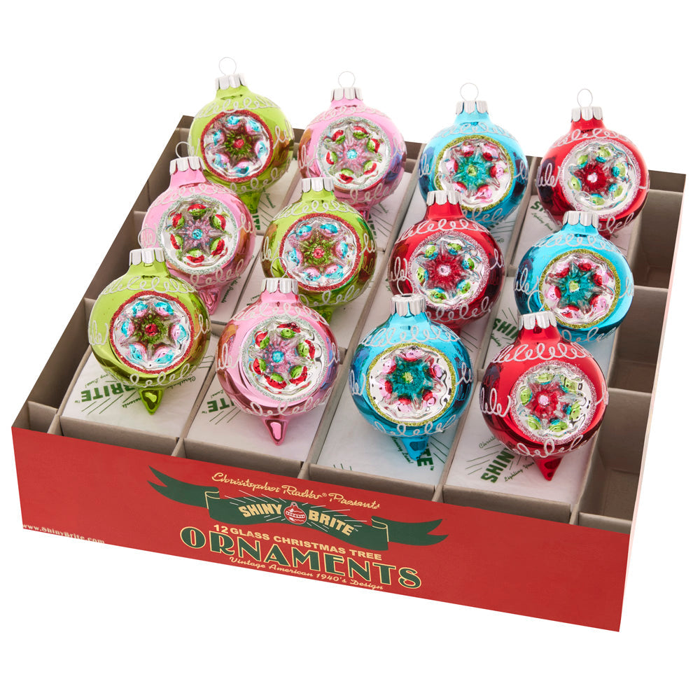 Ornament Set Description - Festive Fete 12 Count 1.75" Decorated Reflector Rounds: Crafted in the signature style of your favorite vintage ornaments, these 12 reflective glass rounds add dimension and nostalgic joy to your tree!