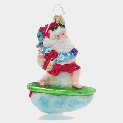 Video - Ornament Description - Surf's Up Santa: Cowabunga, dude! Santa hangs ten and surfs to shore to make sure all the beach babies out there get their presents too! This video shows the ornament spinning slowly. 