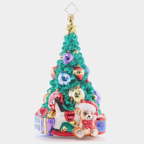 Video - Ornament Description - Tastefully Trimmed Tree: A tree lined with toys fills a child's heart with great joy! With presents ready to delight this tree shines from the greatest of heights. This video shows the ornament spinning slowly. 