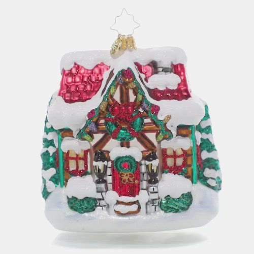 Video - Ornament Description - The Coziest Cottage: The snow is coming down! Drifts are piling up and this little cottage is looking cozier by the minute with its holiday lights and a festive wreath. This video shows the ornament slowly spinning. 