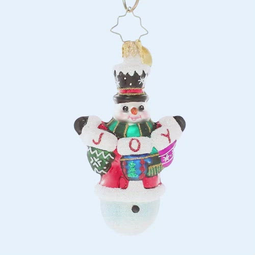 Video - Ornament Description - Crochet All Day Gem: This little snowman has been hard at work with his crochet needles! He's proud as punch to show off his heartfelt, hand-made holiday message. The ornament spins slowly in the video.