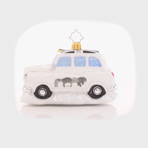 Video - Ornament Description - The Beatles' Roving Revolver Taxi: The show's tonight, and the The Fab Four are running behind. Hightail it, cabbie, they're on in 5! Through the London streets they race, arriving to the stage door with a feverish pace. The lights go dim, the fans all flock. Just as the curtains open, Paul shouts,"are you ready to rock?" This video shows the ornament spinning slowly. 