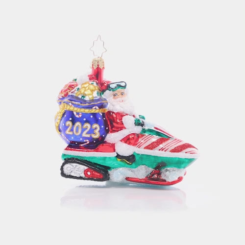 Video - Front - Ornament Description - Vroom Vroom Santa: Santa has the need for speed! He'll deliver presents in half the time this year thanks to his new snow-mobile. This video shows the ornament spinning slowly. 