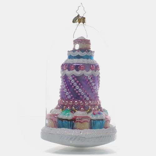 Video - Ornament Description - Perfect Patisserie: Who doesn't love admiring the beautiful sweets and treats on display behind the glass inside the local bake shop? Ooh and ahh at the pastel perfection in this adorable glass domed ornament of your own. This video shows the ornament spinning slowly. 