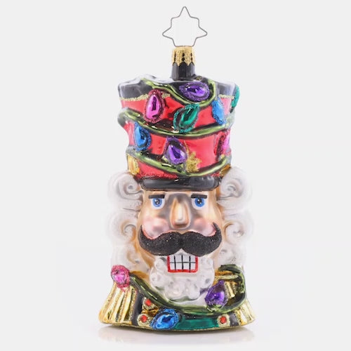 Video - Ornament Description - Bright Light Nutcracker: With colorful Christmas lights twisted around his tall top-hat, this Nutcracker "cracks" the best smile he's got – brightening up your tree in more ways than one!